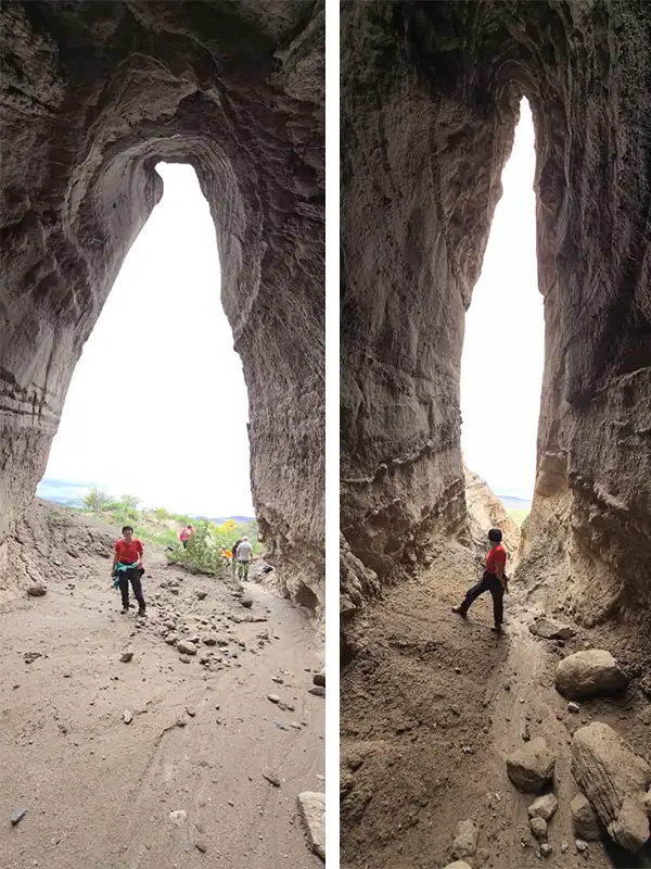 magen doble de los Murallones en Puerto Viejo, Catamarca. Se observa a una persona caminando por pasadizos profundos y estrechos rodeados de imponentes paredes verticales de tierra esculpidas por la erosión.
